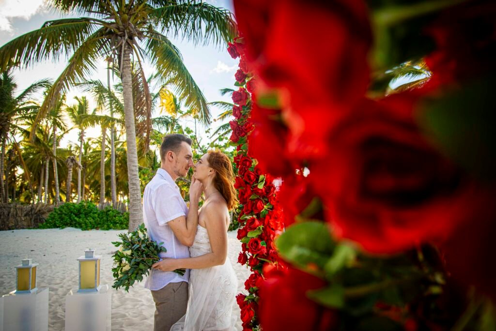 Couple embracing at their beach wedding